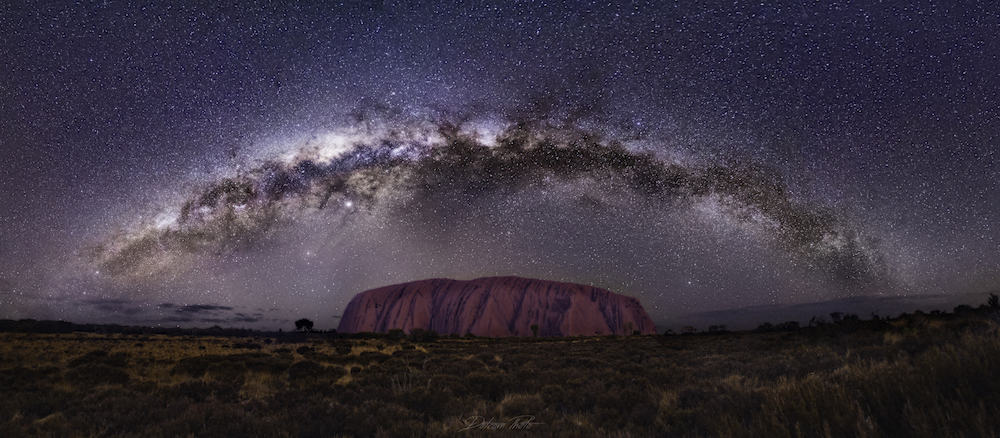 composition shot of the milky way over a landmark