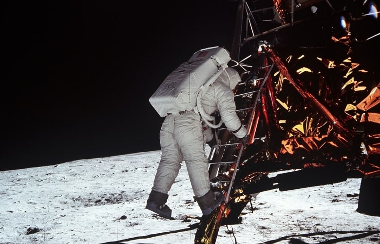 Astronaut Edwin E. Aldrin Jr. descends the steps of the Lunar Module (LM) ladder as he prepares to walk on the moon.