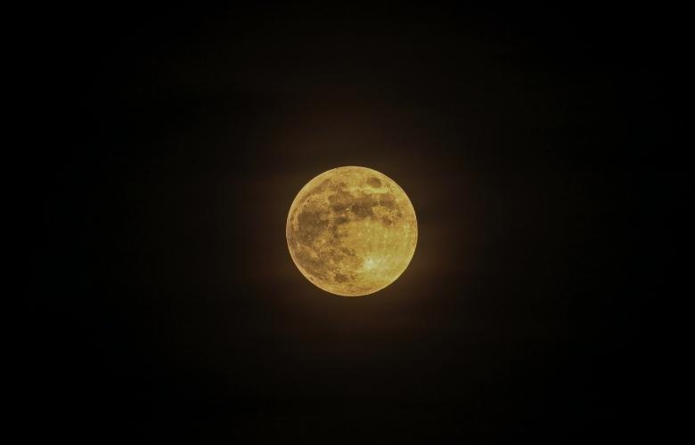 Full moon in the dark night sky