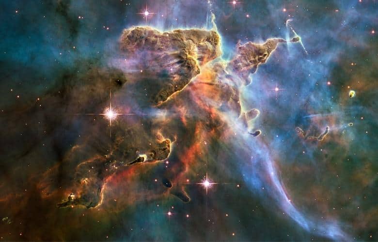 The Hubble Space Telescope captured this billowing cloud of cold interstellar gas and dust rising from the Carina Nebula's tempestuous stellar nursery.
