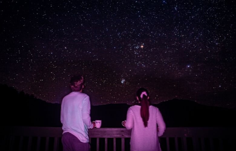 The couple were astounded by the view of the stars in the sky.